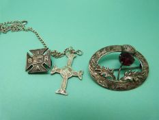 A hallmarked Scottish silver brooch in the form of a thistle,