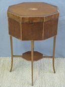 An octagonal work box with shell inlay to the lid raised on tapering legs,
