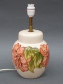 A Moorcroft lamp in the Hibiscus pattern on cream ground,
