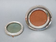 Two early 20thC hallmarked silver circular photograph frames,