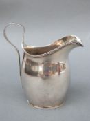 A Georgian style Edward VIII hallmarked silver jug, London 1936, maker D & J Wellby Ltd.