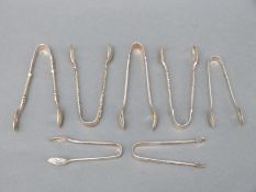 Seven various sets of Victorian and later hallmarked silver sugar nips or tongs,