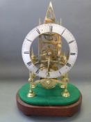 A brass skeleton timepiece with single fusee movement, silver Roman chapter ring and moon hands,