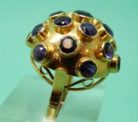 An 18ct gold ring set with amethysts in a cluster (size N)