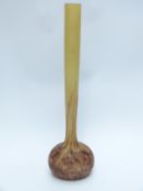 A French Galle style glass vase with elongated neck and speckled bulbous base,
