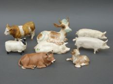 Three Beswick pigs, Beswick sheep, boxed Goebel cow,