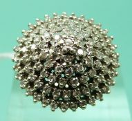A 9ct gold ring set with diamonds in a large tiered cluster, total diamond weight 1ct (size L),