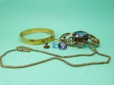 A 19thC silver gilt aesthetic style bangle, a Victorian brooch set with an amethyst,