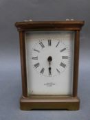 Mappin & Webb French brass corniche style case carriage clock with enamelled Roman dial,