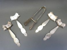 A set of silver plated asparagus servers and four plated carrying handles