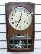 A Dutch mid 20thC Stoelklok, together with a 1970s 30 day calendar wall clock with Japan movement,