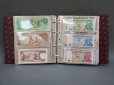 One hundred world bank notes in collectors' album to include Reichsbanknotes, Argentina, Zambia,