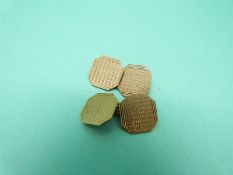 A pair of 9ct gold cufflinks with engine turned decoration (6.