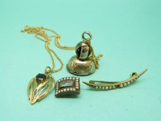 A 9ct gold necklace, a 9ct gold pendant set with a garnet, a Victorian seal,