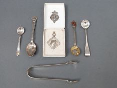 A quantity of hallmarked silver cutlery including sugar tongs,