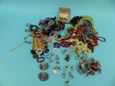 A collection of costume jewellery including silver brooch, beads, Wedgwood brooch,