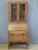 An oak glazed bureau bookcase (W74 x D44 x H178cm)