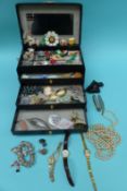 A collection of costume jewellery to include Longines watch, lucite brooch, brooches,