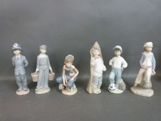Five Lladro figures including football player,
