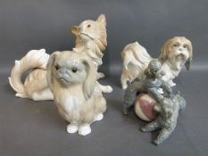 Four larger Lladro dog figures including poodles with ball