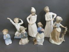 A collection of Nao child figures including girl with butterfly