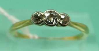 An 18ct gold ring set with three diamonds (size M), weight 1.
