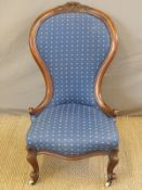 A 19thC spoon back nursing chair