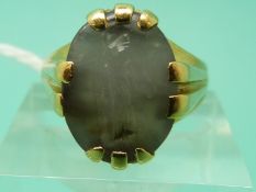 A yellow metal ring set with an intaglio depicting a man, 11.