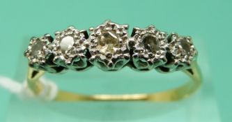 An 18ct gold ring set with five diamonds in a platinum illusion setting (size R), weight 2.