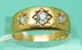 An 18ct gold ring set with old mine cut diamonds in star settings, Birmingham 1882 (size M),