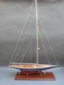 A model sailing yacht on stand,