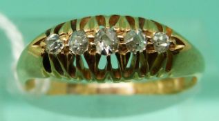 An 18ct gold ring set with five diamonds, Birmingham 1915 (size N), weight 2.