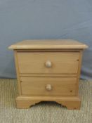 A low pine chest of drawers,