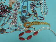 A collection of necklaces to include pearls, agate and pearl, tigers eye and pearl,