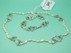 A silver and pearl necklace set with blue/green enamel with matching bracelet by Liberty & Co.
