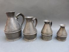 A graduated set of four pewter haystack measures by Munster Iron Co, Cork,