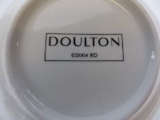 An extensive Doulton dinner and tea service with pale blue and gold banded decoration,