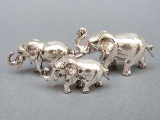 A graduated set of three hallmarked silver elephants,