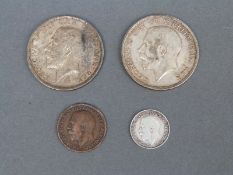 A WWI Christmas 1914 Queen Mary tin, containing 1914 and 1915 VF halfcrowns,