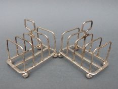 A pair of George V hallmarked silver four-slice toast racks, Sheffield 1911 maker Atkin Brothers,