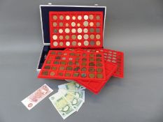 An aluminium collector's case containing an amateur collection of UK and overseas coins,