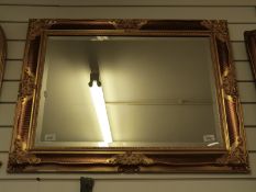 A bevelled mirror with gilt frame (overall size 86 x 68cm)