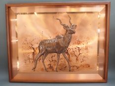 A large retro African copper relief picture of an Eland,