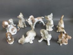 Nine Lladro dog and cat figures and one other
