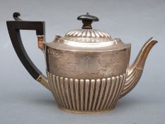 A Victorian hallmarked silver bachelor's teapot with fluted lower section, Birmingham 1896,
