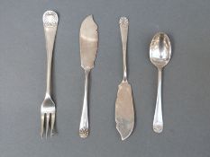 A pair of Victorian hallmarked silver shell pattern hallmarked silver butter knives,