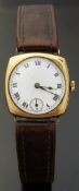 Swiss 9ct gold cushion shaped gentleman's wristwatch with black Roman numerals,
