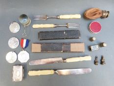 A quantity of items to include magnifying glass, silver spoons,