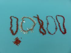 Three coral necklaces and a coral and a mother-of-pearl example