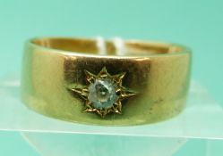 An 18ct gold ring set with an old cut diamond in a star setting, Chester 1912 (size M), weight 5.